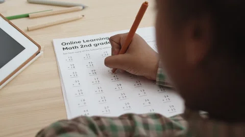 Unrecognizable Kid Solving Addition Problems Stock Footage 146630261
