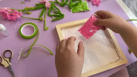 Unrecognizable kid sprinkling decorative glitter powder template Stock Footage 342347752