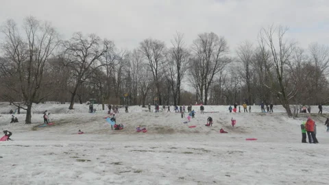 Unrecognizable kids sledding Stock Footage 265846813