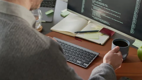 Unrecognizable Male Programmer Working at Office Desk Stock Footage 306838659