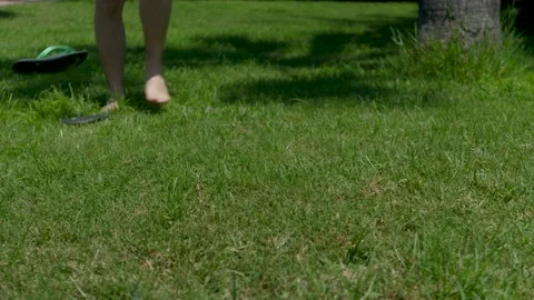 Unrecognizable Male Took Off Flip-flops And Enjoys Standing Barefoot On Cut Stock Footage 166487651