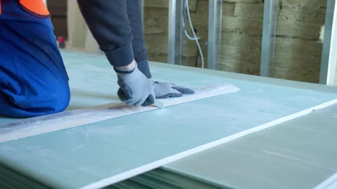 Unrecognizable male worker cutting panel during work Stock Footage 154393223