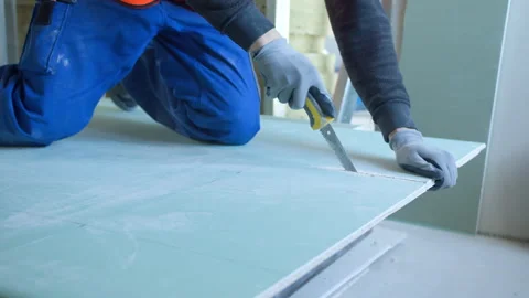 Unrecognizable male worker cutting panel during work Stock Footage 154393377