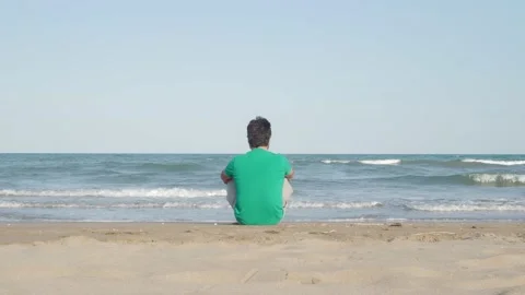 Unrecognizable man from behind sitting watching the sea. Thoughtful man Stock Footage 161603718