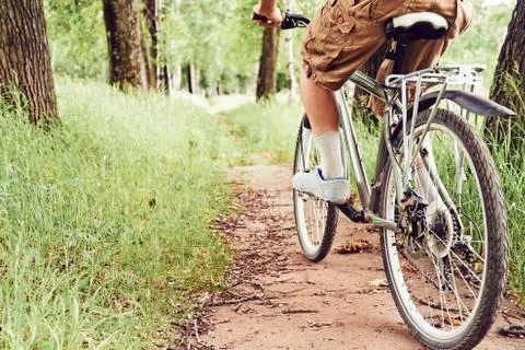 Unrecognizable man is bicycling Stock Photos