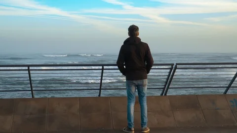 Unrecognizable man with black jacket looking to the Ocean  - Casablanca, Morocco Stock Footage 126012584