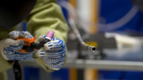 Unrecognizable man brew with semi-automatic cleaned metal tube use piece of wire Stock Footage 126358001