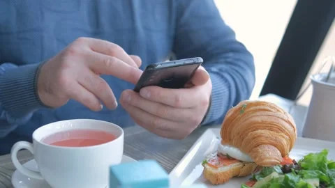Unrecognizable man businessman sitting at table in cafe cafeteria restaurant Stock Footage 243273909