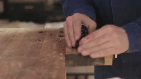 Unrecognizable man carpenter in workshop grinding polishing machine wood  動画素材 88058356