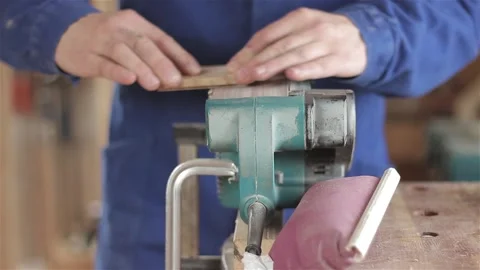 Unrecognizable man carpenter in workshop grinding polishing machine wood  動画素材 88348193