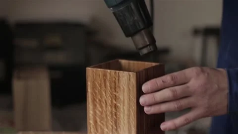 Unrecognizable man carpenter in workshop oiling polishing wood planking box item 스톡 동영상 88425014