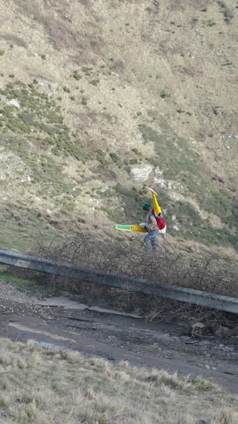 An unrecognizable man carries something while walking Stock Footage 273622310