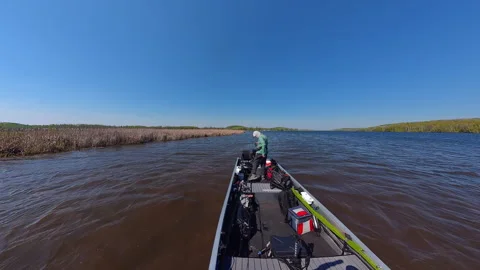 Unrecognizable man casting rod and spinning fishing reel on small fishing b.. Stock Footage 341779993