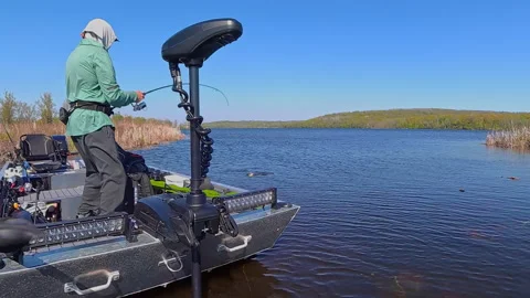 Unrecognizable man casting rod and spinning fishing reel on small fishing b.. Stock Footage 341780039