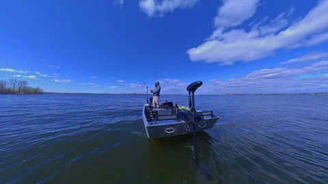 Unrecognizable man casting rod and spinning fishing reel on small fishing b.. Stock Footage 346310217