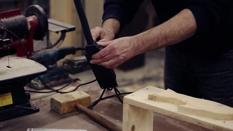 Unrecognizable man connects equipment to electrical power, place his form on Stock-Footage 121502091