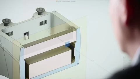 An unrecognizable man develops the design of a part. An engineer works with a 3D Video stock 202829579