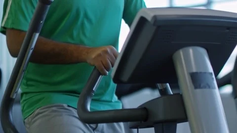 Unrecognizable Man Doing Cardio on Elliptical Machine Stock Footage 91526598