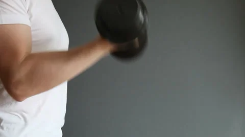 Unrecognizable man doing exercises with dumbbells Stock Footage 30370420