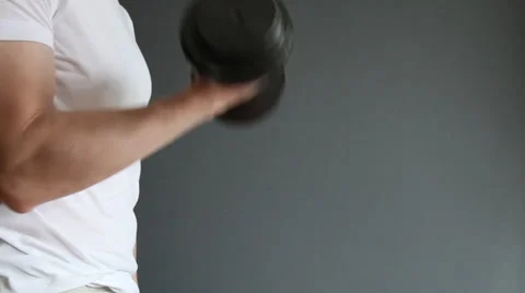 Unrecognizable man doing exercises with dumbbells Stock Footage 30370844