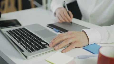 An unrecognizable man draws on a graphic tablet. Remote work. Freelance. Video Stock-Footage 160914061