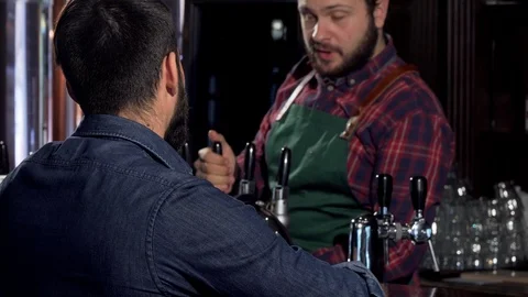 Unrecognizable man drinking delicious craft beer at the pub Stock Footage 103051358