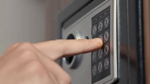 Unrecognizable Man Entering Code for Opening Safe Stock Footage 247373971