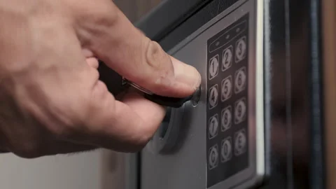 Unrecognizable Man Entering Code for Opening Safe Stock Footage 247374997