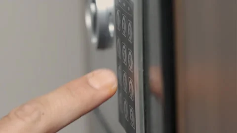 Unrecognizable Man Entering Code for Opening Safe Stock Footage 247376702