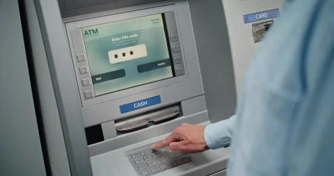Unrecognizable Man Entering PIN Code on Keypad, Taking US Dollars from ATM Stock Footage 309290750