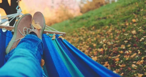 Unrecognizable Man Feet, Relax in a Hammock in Calm Autumn Outdoor. SLOW MOTION Stock Footage 140294437