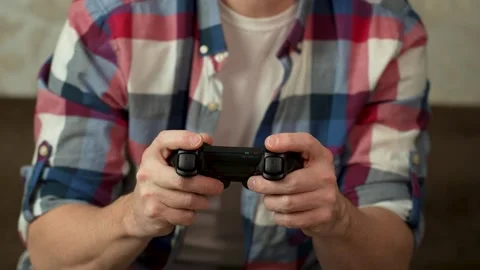Unrecognizable man gaming at home Stock Footage 265880293