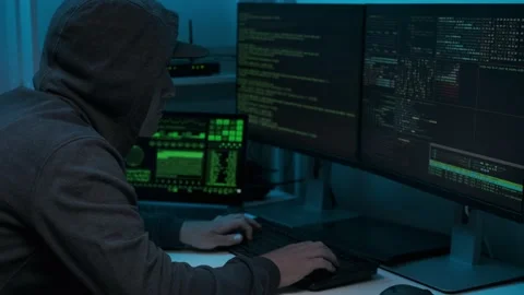 Unrecognizable man hacker wearing sweatshirt with hood typing on computer Stock Footage 155280440