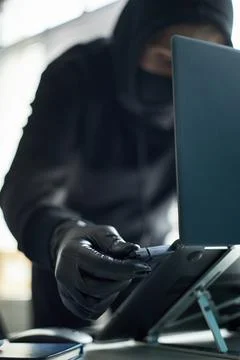Unrecognizable Man Hacking Computer System Using Malware on Usb Device 库存照片