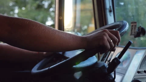 Unrecognizable man holding his hands on steering wheel and driving car Stock Footage
