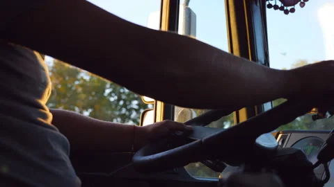 Unrecognizable man holding his hands on steering wheel and driving a truck Stock-Footage 229337372