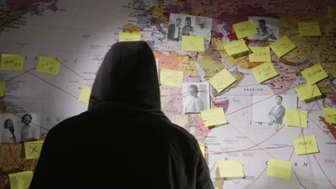 Unrecognizable man in hood making notes on paper stickers Stock-Footage 181801603