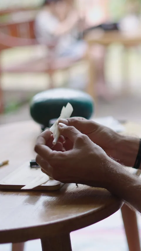 Unrecognizable man prepares a joint of weed Stock Footage 267505659