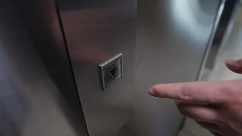 Unrecognizable Man Pressing Down Button in Elevator Video stock 312854858