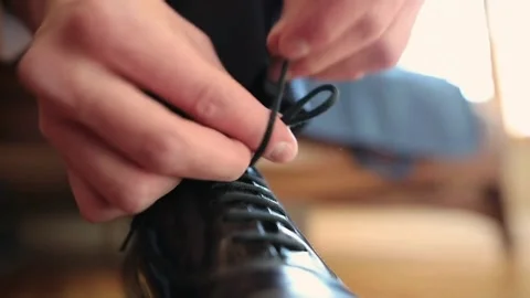 Unrecognizable man put on shoe preparing for formal event. Close up of shoe.. Stock Footage 265940849