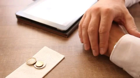 Unrecognizable man putting gratuity on the table in coffee bar Stock Footage 54690387