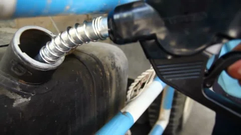 Unrecognizable man refueling a tank at a gas station Car At Gas Station Stock Footage 336569464