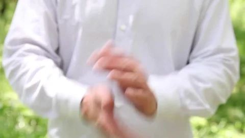 Unrecognizable man shaking off his hands an showing thumb up Video stock 71049502