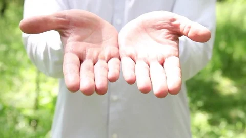 Unrecognizable man showing his empty palm Stock Footage 71049580