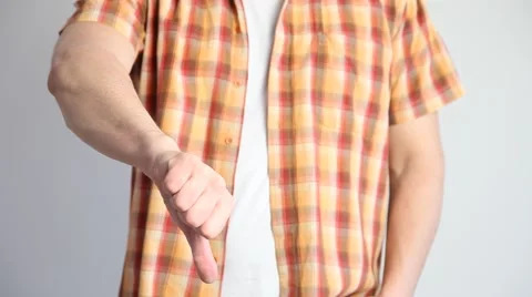 Unrecognizable man showing a thumb down sign Stock Footage 60408391