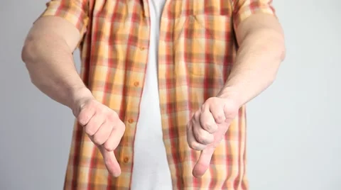 Unrecognizable man showing a thumb down sign Stock Footage 60408424