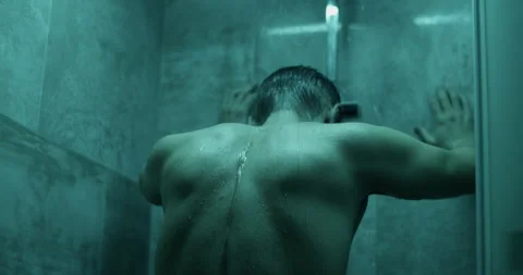 Unrecognizable man standing under bathroom shower Stock Footage 271159776