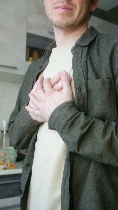 Unrecognizable man suffering from a heart attack Stock Footage 337893054