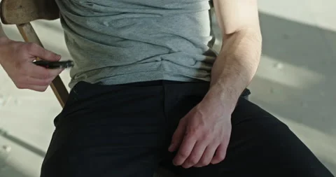 Unrecognizable man taking knife out of pocket Vídeo Stock 153382314