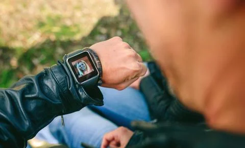 Unrecognizable man talking by videoconference with his smartwatch Stock Photos